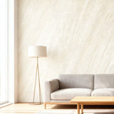 Gray sofa in a modern living room with a wooden coffee table and a plant.